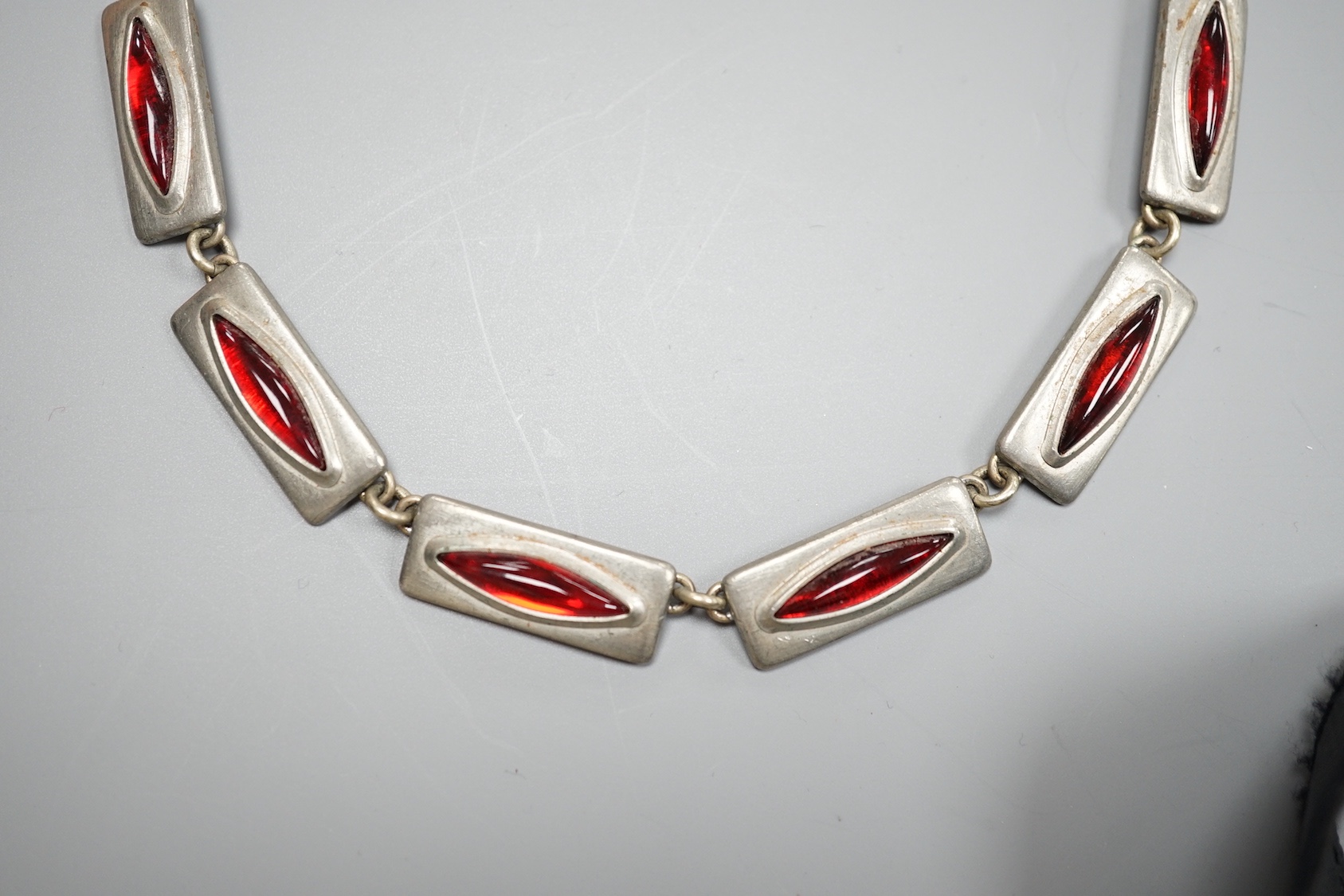 A stylish Jorgen Jensen pewter and red paste set necklace, 39cm.